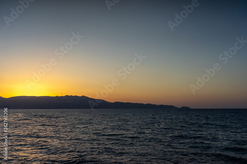 Rock groyne at sunset, Crete, Greece
