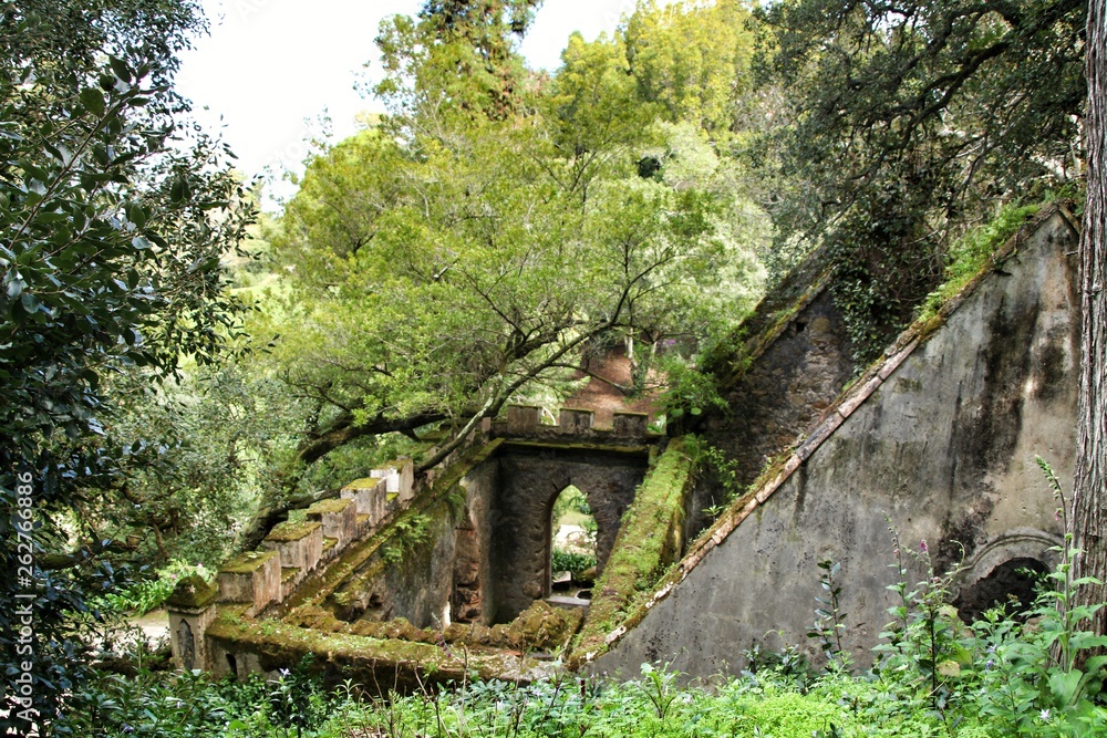 Ancient stone ruins in a leafy garden of Sintra
