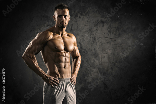 Strong Muscular Men Flexing Muscles © mrbigphoto