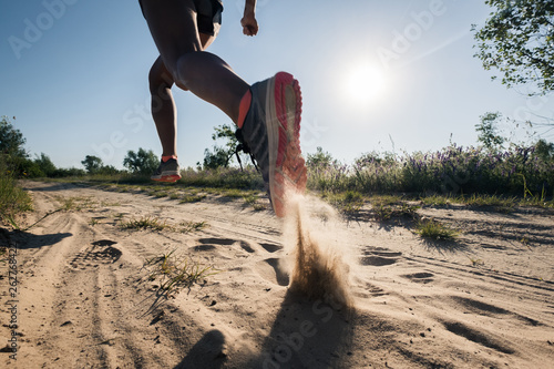 Sport running man in cross country trail run