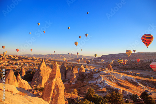 Amazing sunrise over Cappadocia. Colorful hot air balloons. © lizavetta