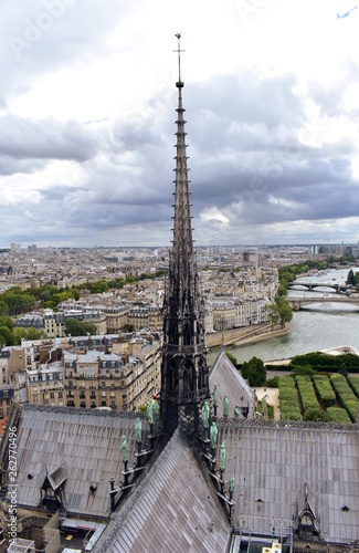 Notre Dame Spire, La Fleche, and lead clad wooden roofs before the fire. Cityscape with the Seine River and bridges. Paris, France.