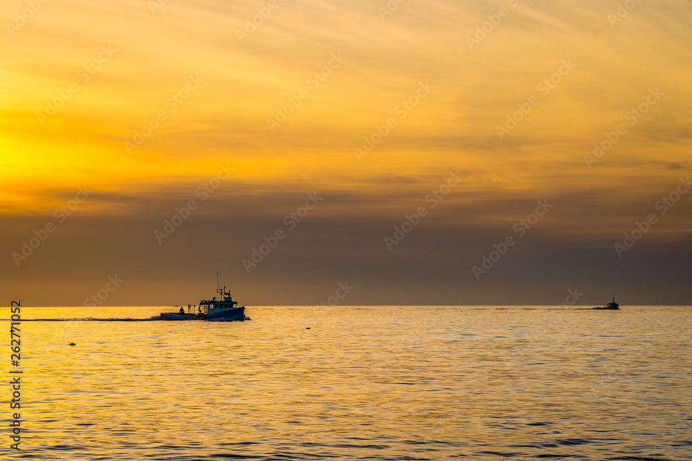 Beautiful Atlantic coastal shoreline scenery of lighthouses and lobster boats.