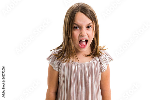 Little young girl is angry, mad, disobedient with bad behaviour.