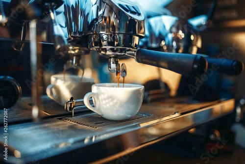 Obraz Espresso machine pours fresh black coffee closeup