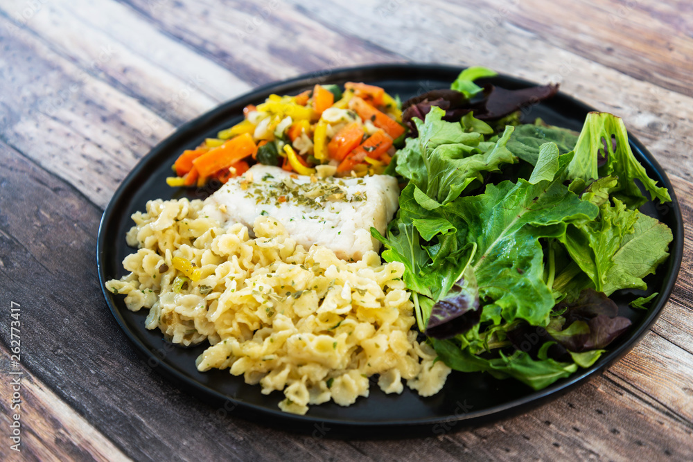 cod fish with vegetables, small vegetables and marine sauce cod fish with vegetables, small vegetables and marine sauce