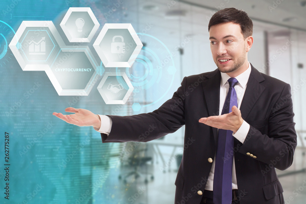 The concept of business, technology, the Internet and the network. A young entrepreneur working on a virtual screen of the future and sees the inscription: Cryptocurrency The concept of business, technology, the Internet and the network. A young entrepreneur working on a virtual screen of the future and sees the inscription: Cryptocurrency