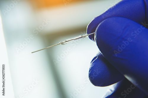 Man holding LED resistance in his arms on blurred background photo