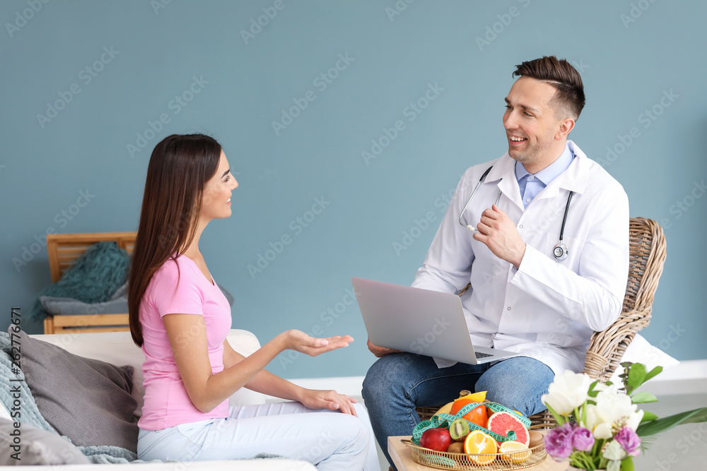 Young woman visiting nutritionist in weight loss clinic Young woman visiting nutritionist in weight loss clinic