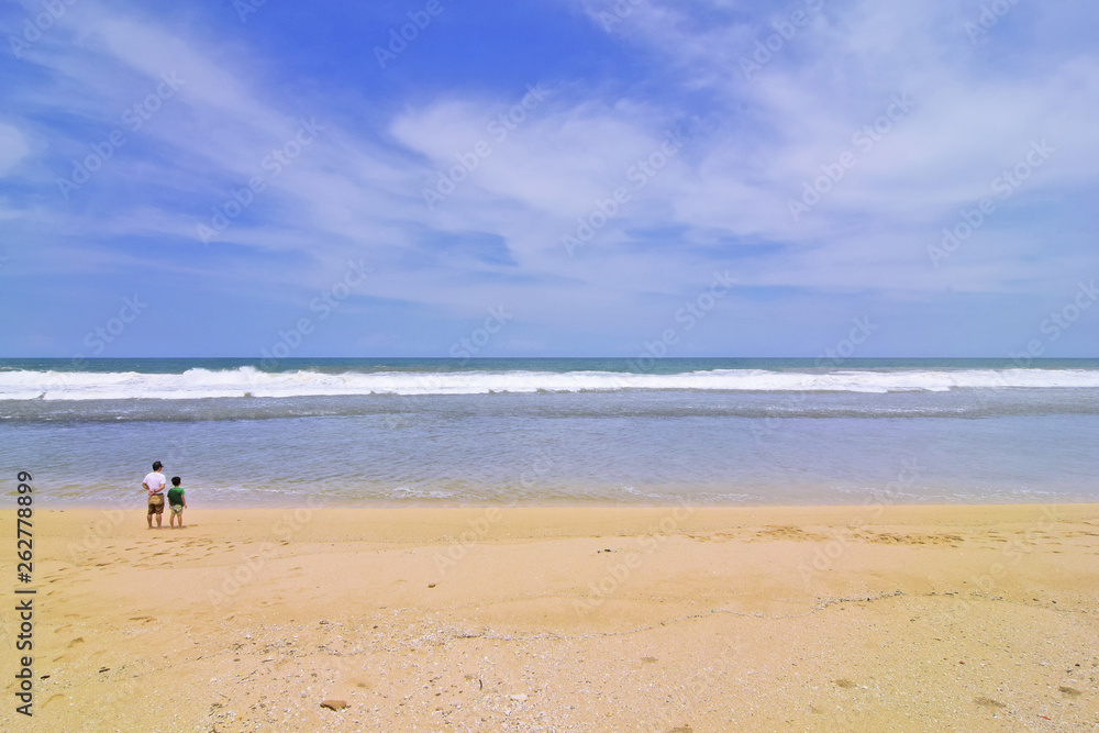 waves on the beach with beautiful white sand and blue sky background