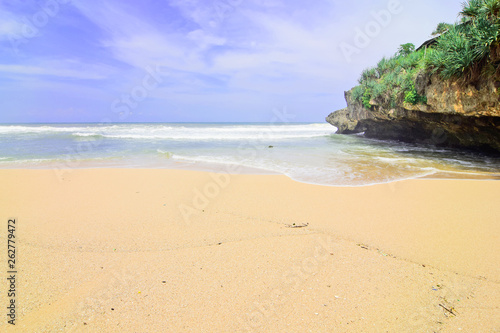 natural views of the south coast in the Yogyakarta region. This beach is named "Drini beach". This beach is white sand, next to it are cliffs and many rocks. This beach is perfect for those of you who