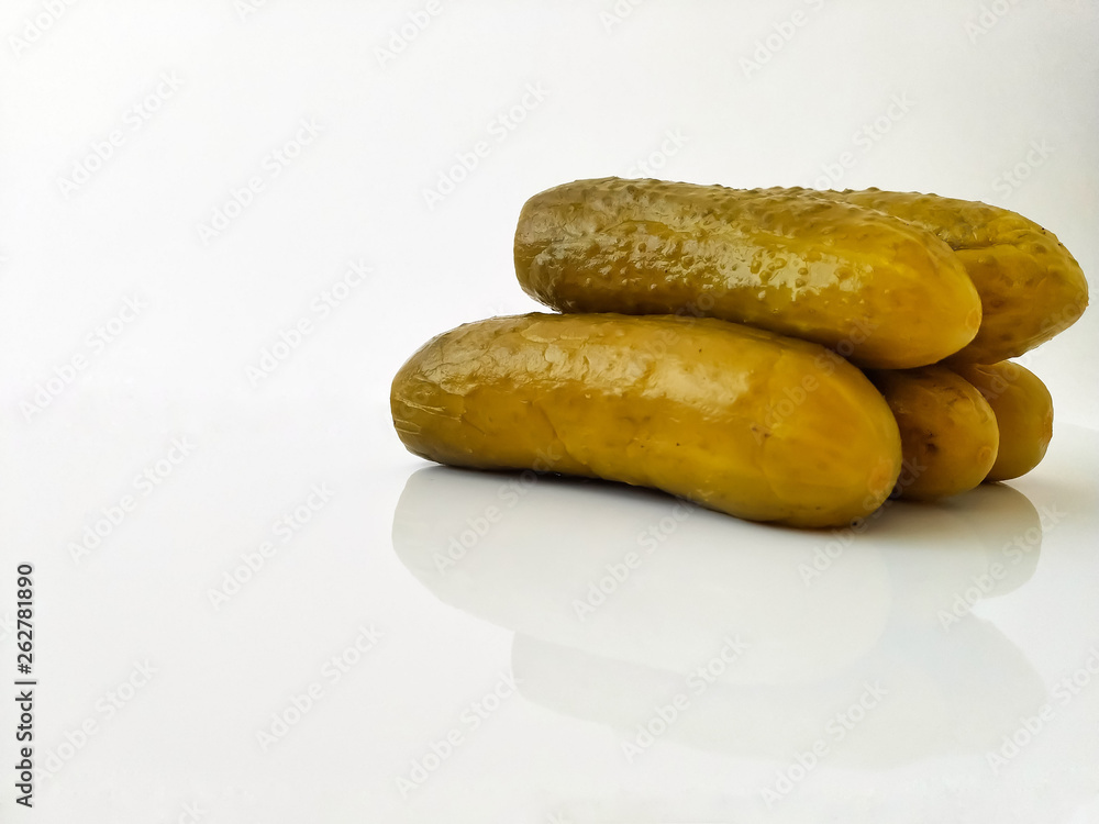 Pickleds cucumber on white background side view. Fermented cucumbers Pickleds cucumber on white background side view. Fermented cucumbers
