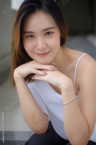 portrait of thai china adult office girl white shirt relax and smile