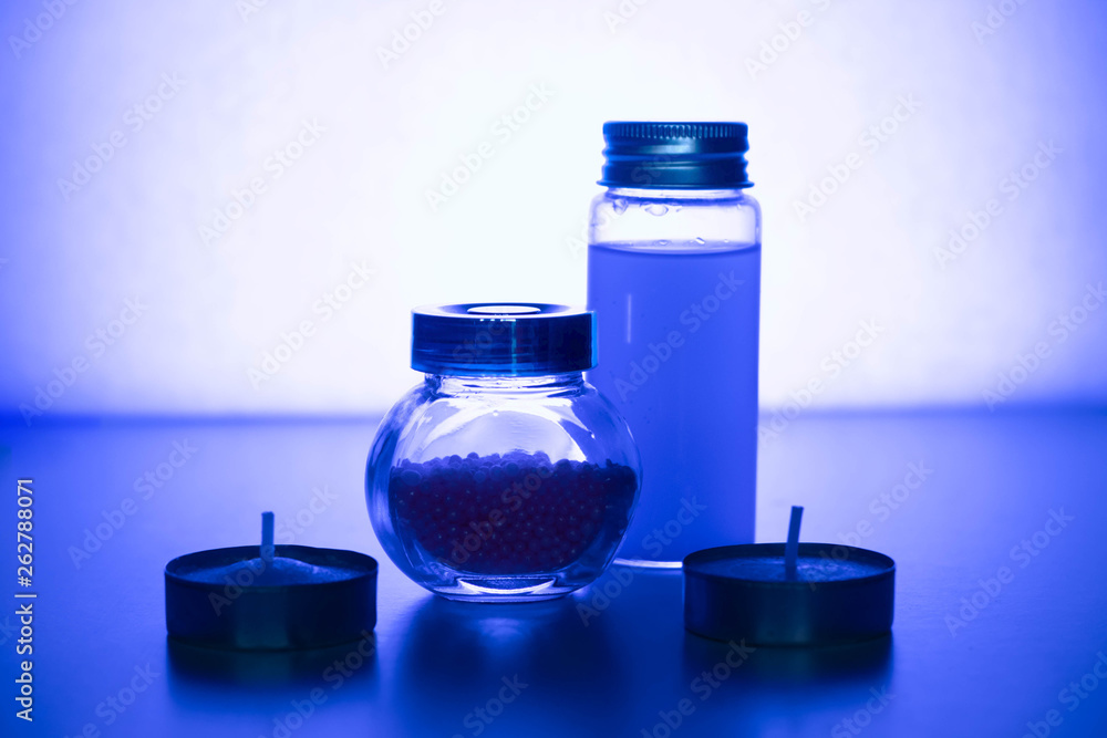 Glass jars on a blue background. Magical decoration Glass jars on a blue background. Magical decoration