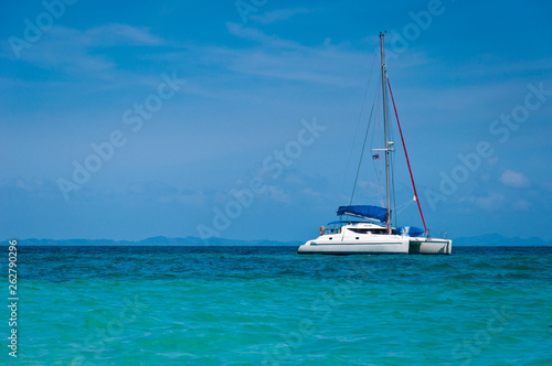 Small yacht in the sea with blue sky