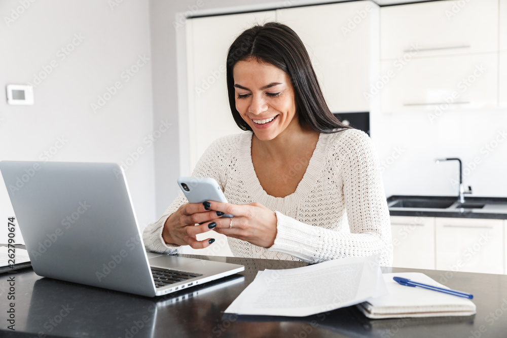 Attractive young woman working with laptop computer Attractive young woman working with laptop computer