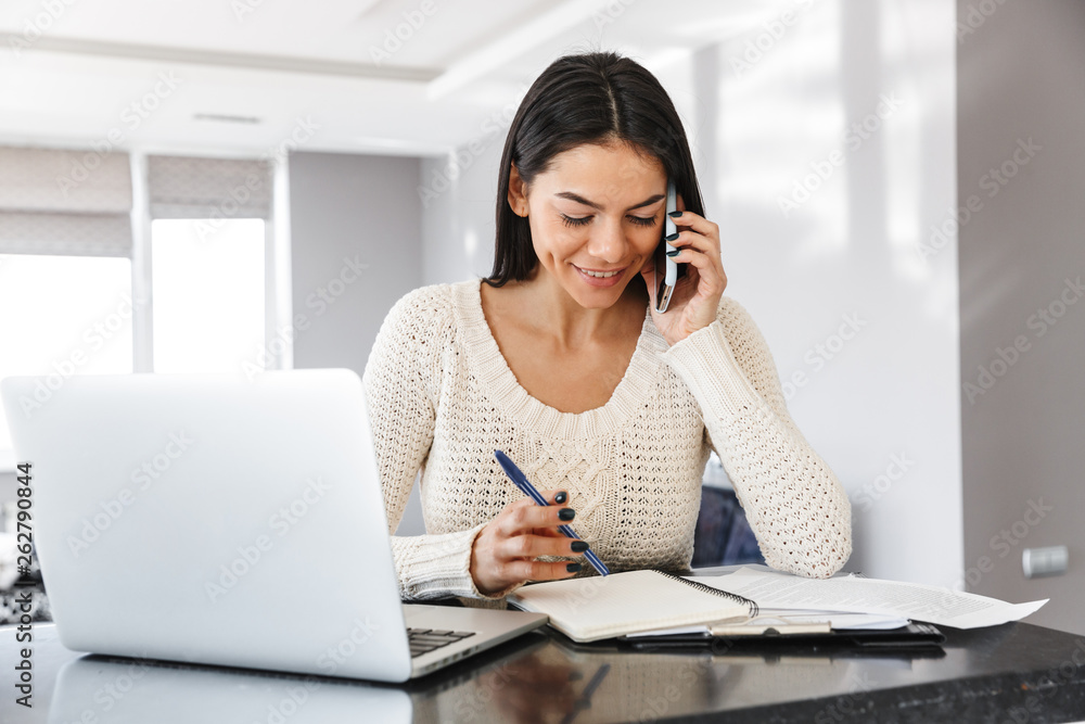 Attractive young woman working with laptop computer Attractive young woman working with laptop computer