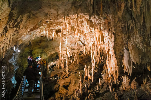 LEVIGLIANI, ITALY - JUNE 05, 2016: Some visitors admire the stalactites of the Antro del Monte Corchia cave in the Apuan Alps in Italy.