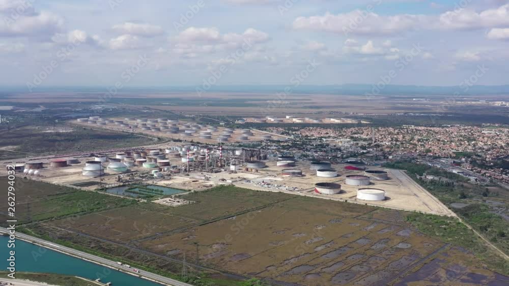 Aerial shot of petrol oil gas storage tanks mediterranean shore France sunny day Aerial shot of petrol oil gas storage tanks mediterranean shore France sunny day