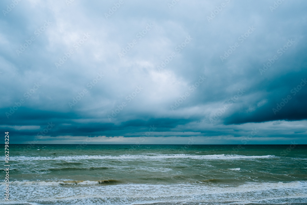 Windy storm beach seashore seaside sea waves dark clouds Windy storm beach seashore seaside sea waves dark clouds
