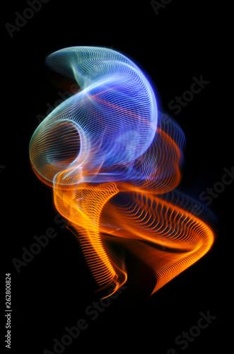 Multicolored twisted ordered parallel lines on a black background. Light in motion. Color abstraction.
