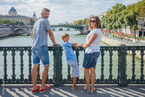 Photography Happy family of three enjoying vacation in Paris, France