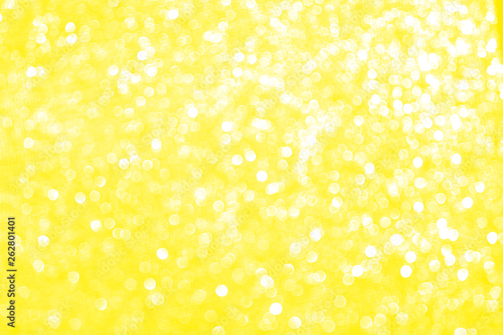 Blurred bokeh light yellow golden party background, Christmas and New Year holidays background. Party concept. Festive holiday card bright backdrop. Defocused. Flat lay, top view, copy space. Blurred bokeh light yellow golden party background, Christmas and New Year holidays background. Party concept. Festive holiday card bright backdrop. Defocused. Flat lay, top view, copy space.