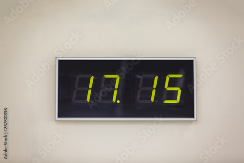 Black digital clock on a white background showing time 17.15 minutes photo