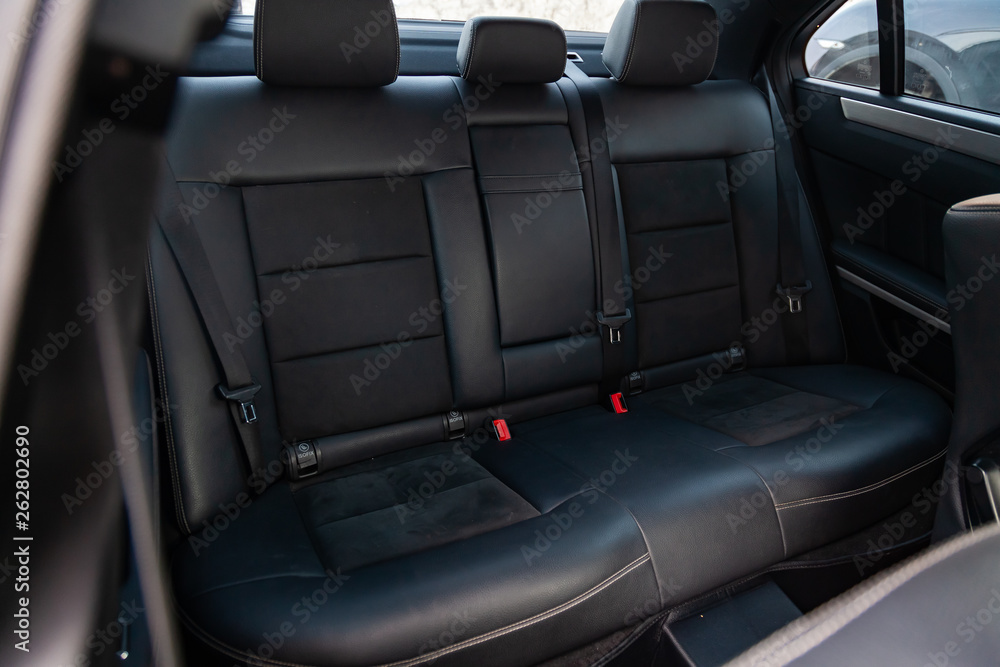 Obraz premium The interior of the car with a view of the rear seats with light gray trim