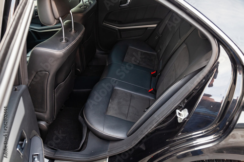 The interior of the car with a view of the rear seats with light gray trim