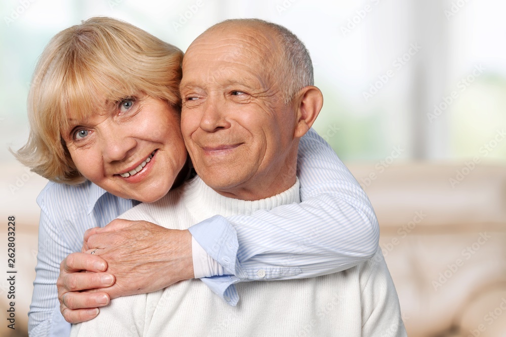 Portrait of happy senior couple smiling at home Portrait of happy senior couple smiling at home