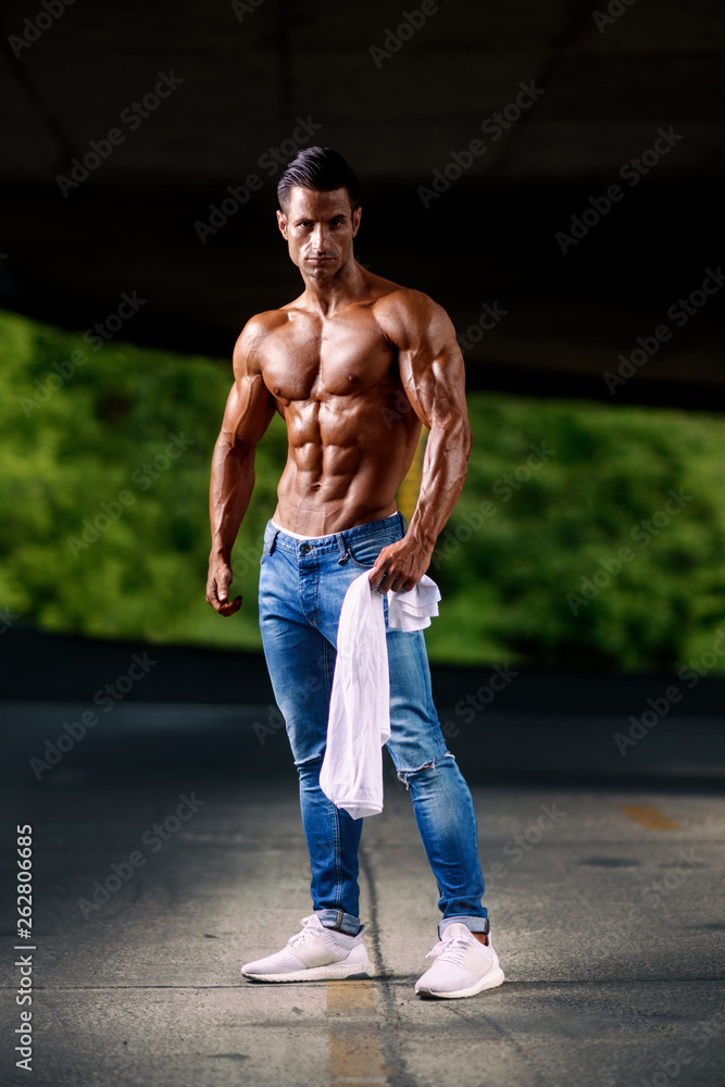 Handsome Shirtless Muscular Men in Jeans Posing Outdoors Stock Photo |  Adobe Stock