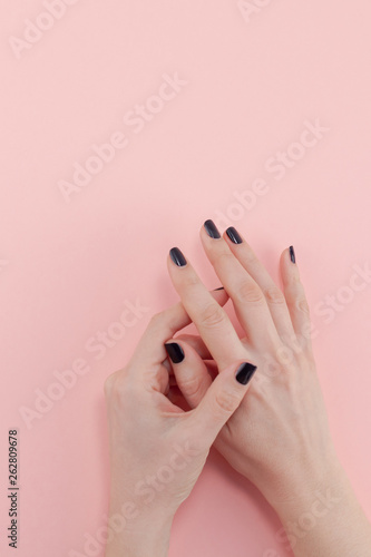 Woman s hands with black manicure