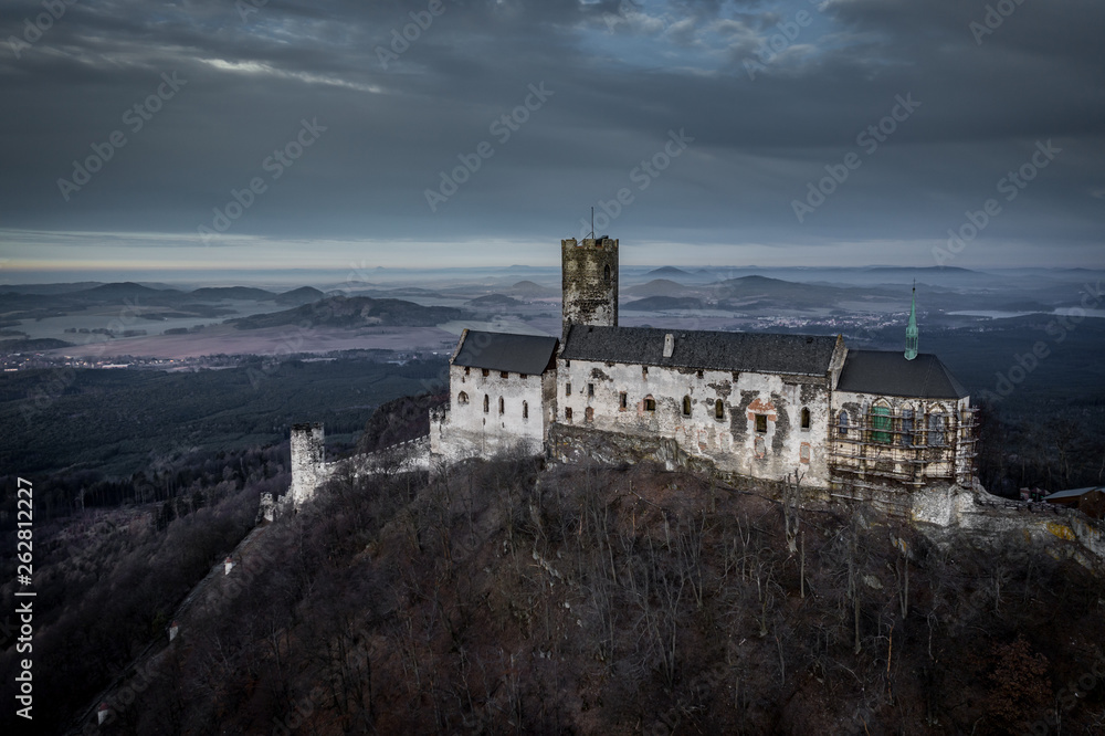Bezděz Castle is a Gothic castle located some 20 kilometres (12 mi) southeast of Česká Lípa, in the Liberec Region, Northern Bohemia, Czech Republic. Its construction began before
