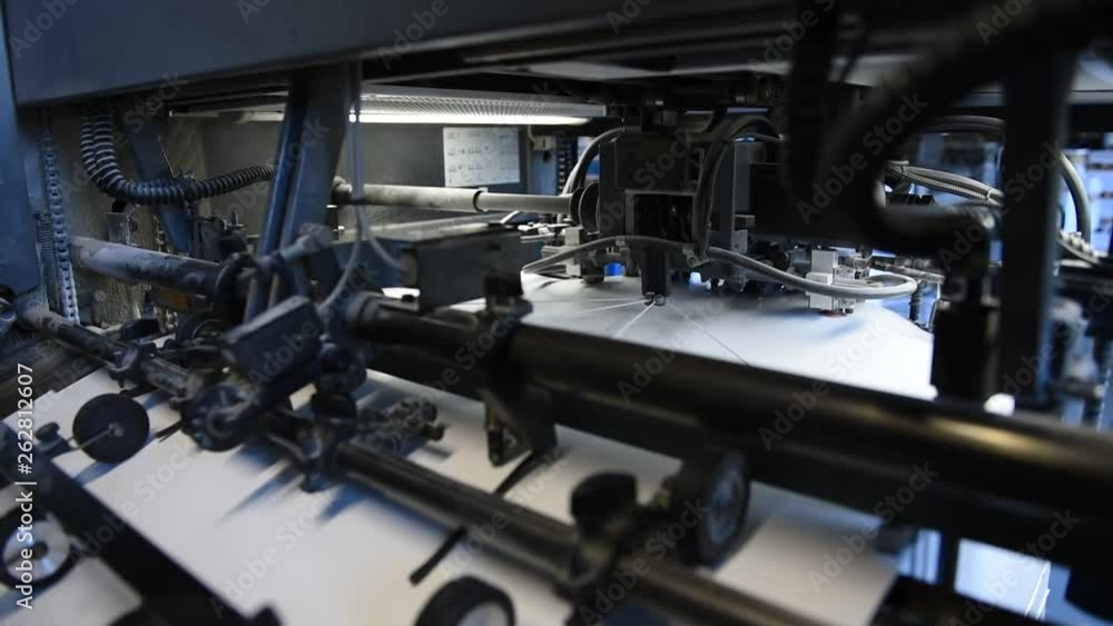 Offset printing. Printed sheets of paper are served in the printing press by vacuum Offset printing. Printed sheets of paper are served in the printing press by vacuum