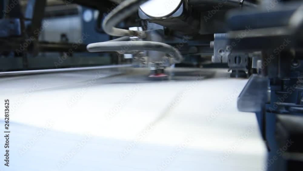Offset printing. Printed sheets of paper are served in the printing press by vacuum Offset printing. Printed sheets of paper are served in the printing press by vacuum