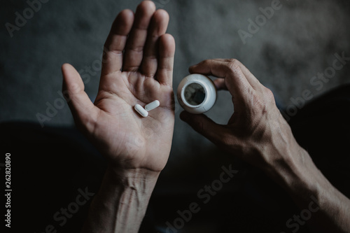 Man holding the pills