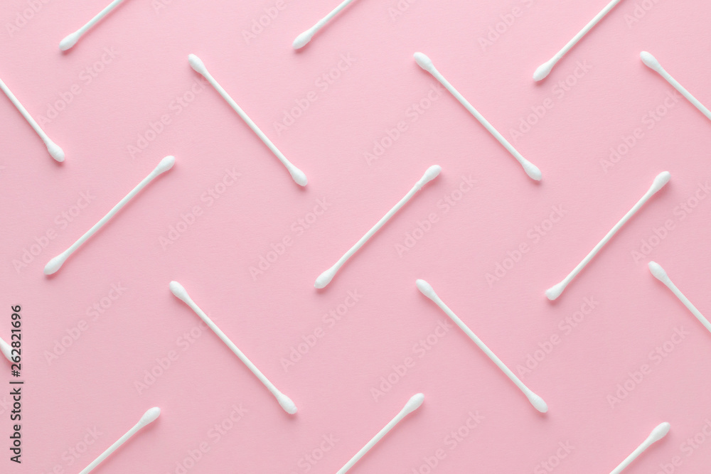 white cotton swabs on pink background, abstract pattern white cotton swabs on pink background, abstract pattern