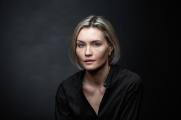 Portrait of a beautiful woman on a dark background