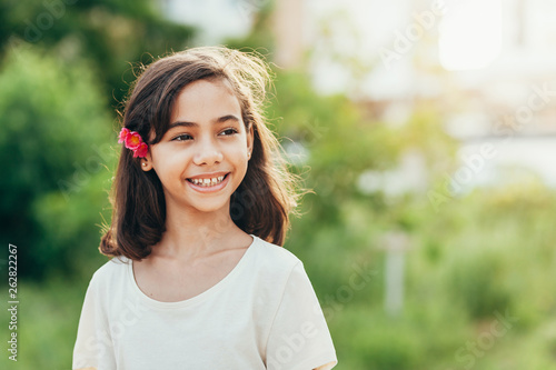 Cute little girl with a flower in her hair