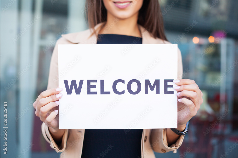 Travel. Women business with the poster with welcome message Travel. Women business with the poster with welcome message