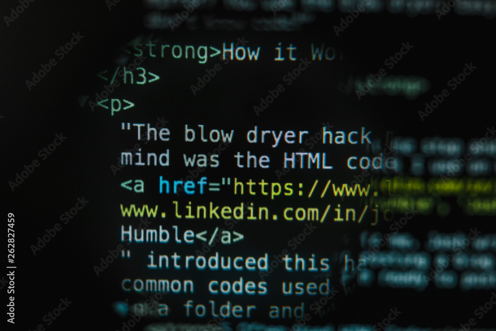 Program code illustrative concept on display screen through magnifying glass Program code illustrative concept on display screen through magnifying glass