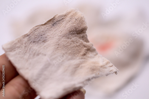 Dirty used cotton pads and stains from remover make up cosmetics on isolate background.