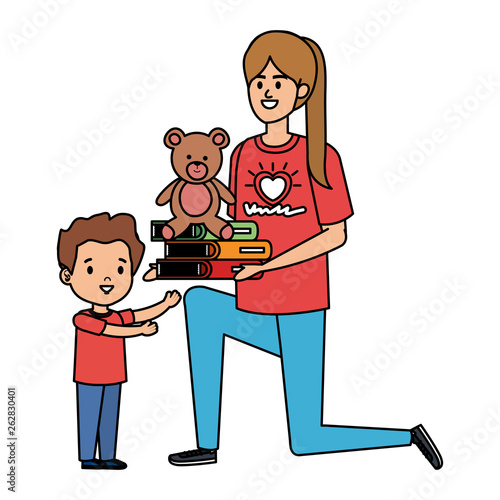 woman volunteer giving a boy books and bear teddy