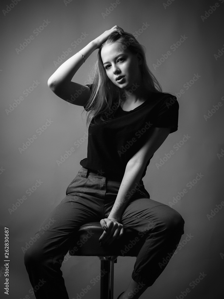 Young woman sitting on the chair. Young woman sitting on the chair.