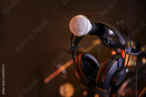 Condenser microphone and headset in modern recording studio. Space for text © New Africa