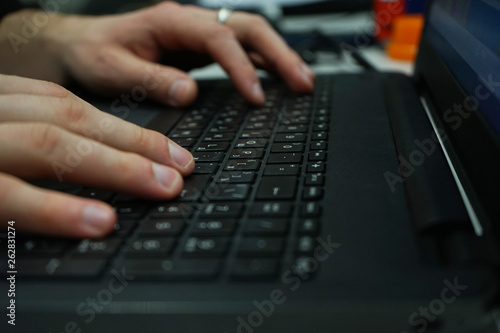working at home office hand on keyboard close up                