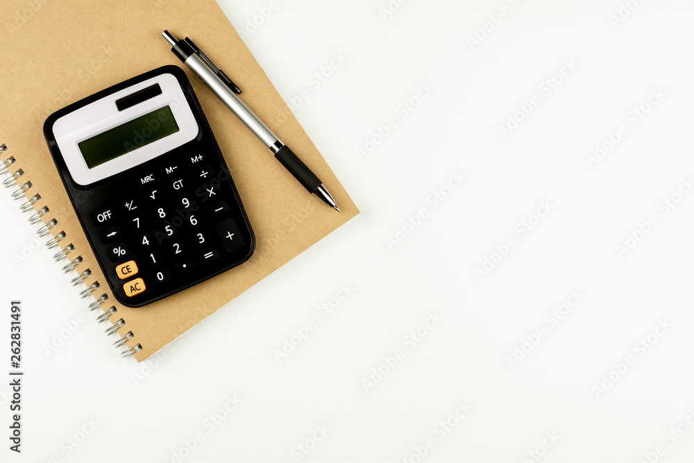 calculator and office supplies on white table. - top view with copy space. calculator and office supplies on white table. - top view with copy space.