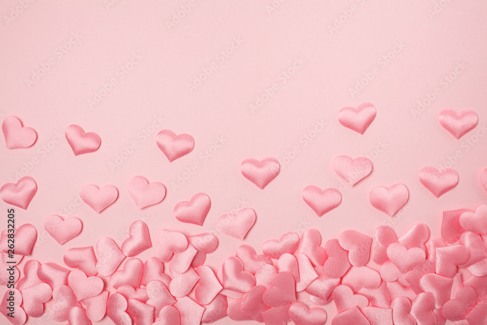 elements in shape of heart flying on pink background. symbols of love for Happy Women's, Mother's, Valentine's Day