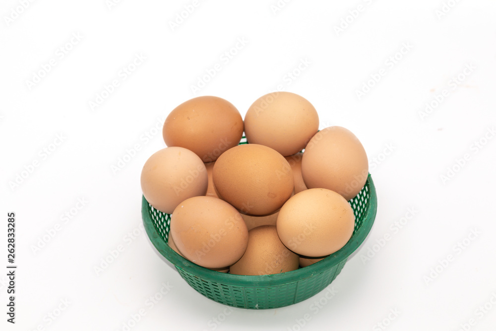 Close up eggs in a green basket isolate on white background. Select focus.